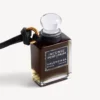 Fragrance miniature bottle charm in black